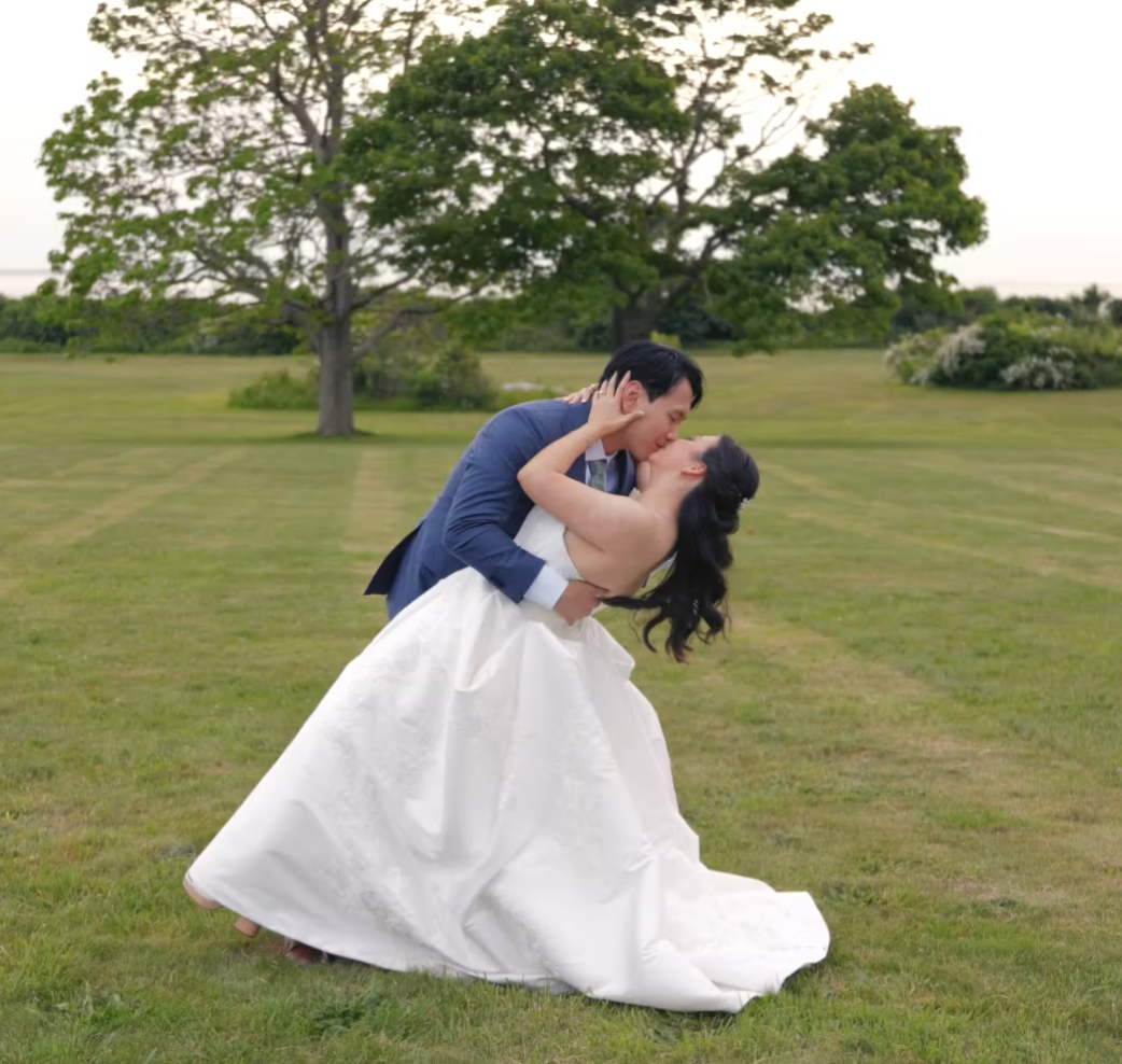 Couple kissing in open field Harkness Park 2026