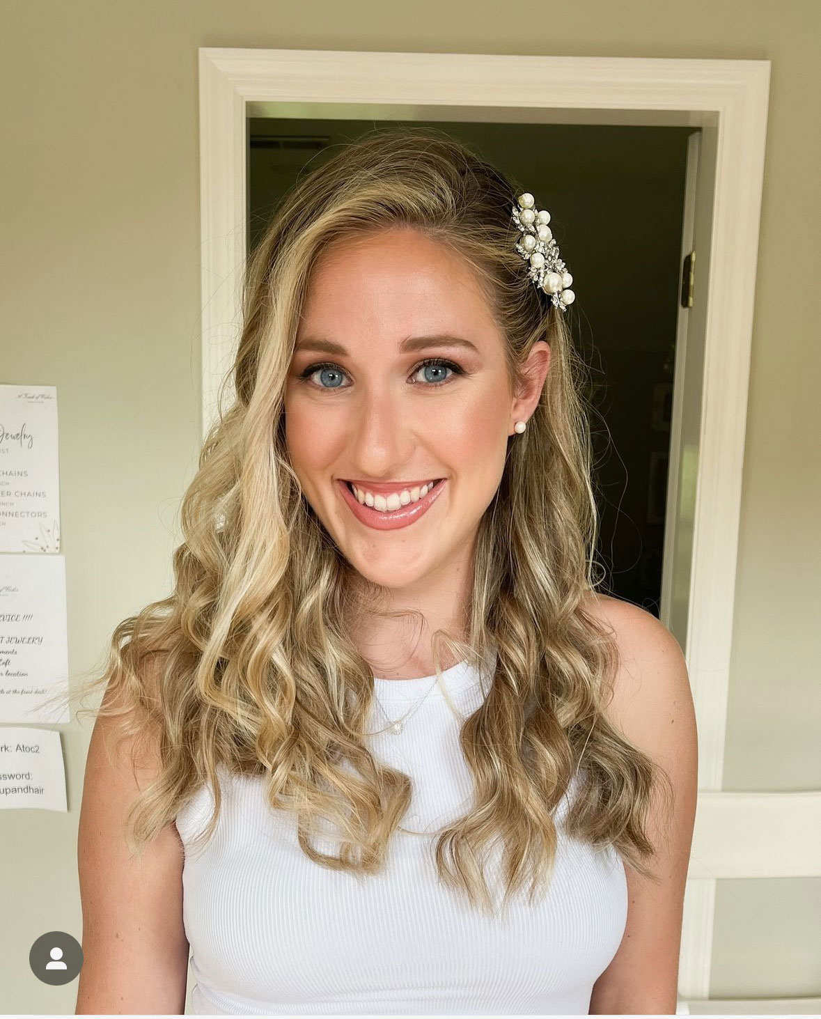 Bride sitting in loft during wedding hair and makeup trial